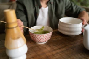 person-having-cup-matcha-tea